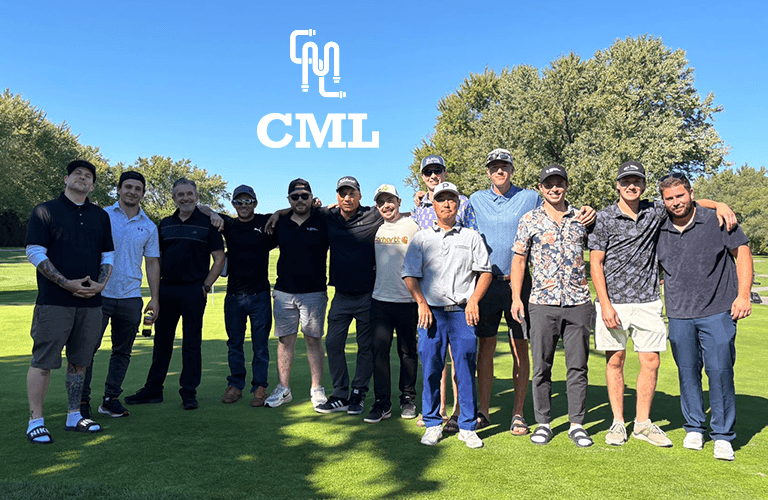 Golf trophy and ball on the green.