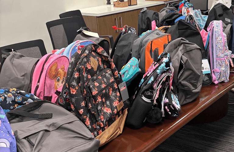 Backpack with school supplies ready for donation.