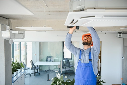 CML team member installing an HVAC system.